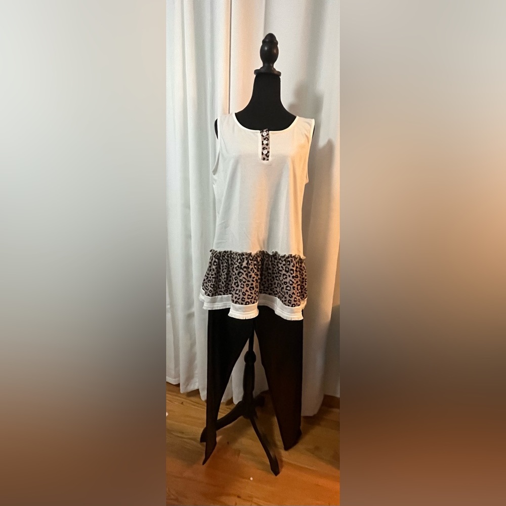 Off-white tank with black&brown leopard trim.   Black pants.   Sold as set.